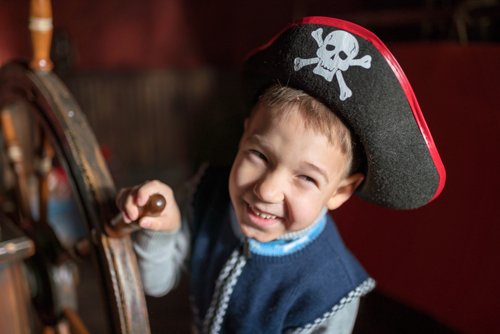 A boy is dressed up as a pirate A boy is dressed up as a pirate
